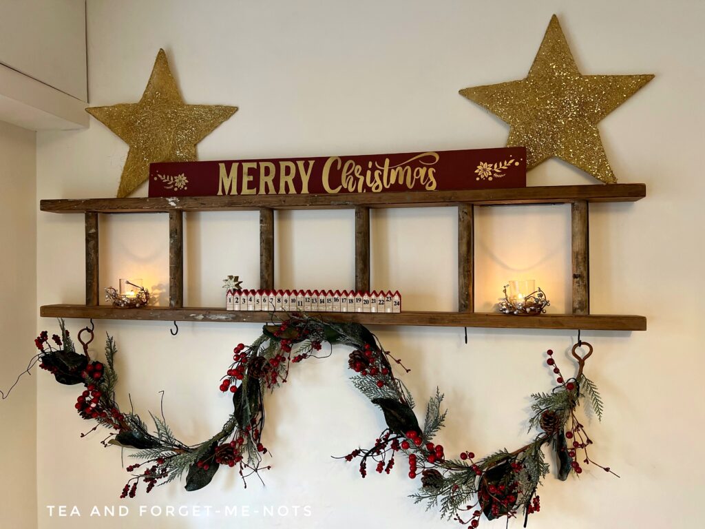 ladder decorated with red for christmas