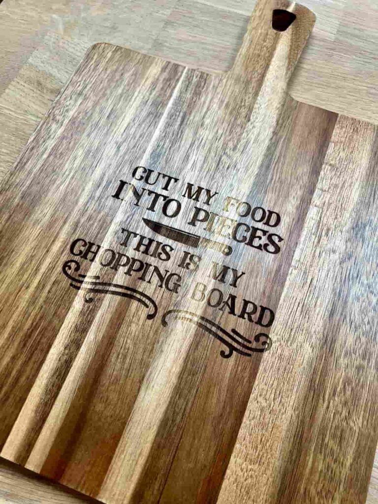 image shows chopping board engraved with song lyrics.