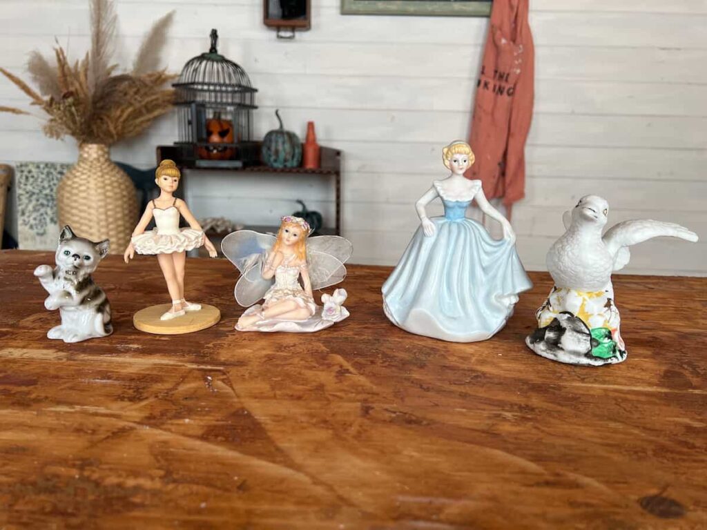 image shows 5 figurines of people and animals.