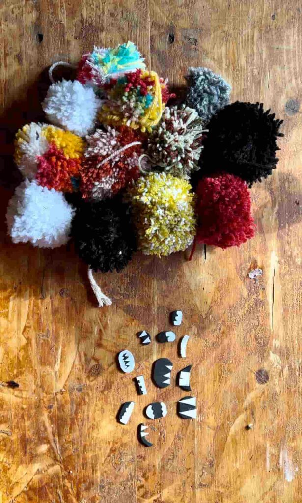 image shows pom poms and mouths to attach to monsters.