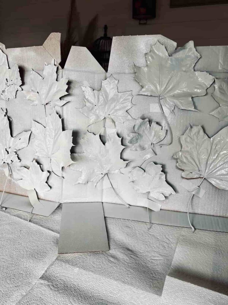 image shows leaves spray painted white.