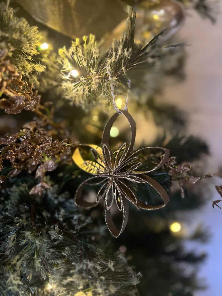 image shows black glittery tree ornament.