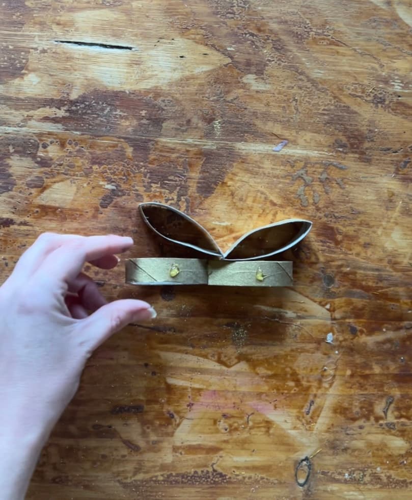 image shows glueing gold toilet paper roll pieces together.