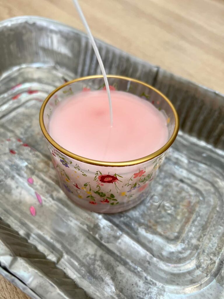 image shows second layer of wax on diy candle.