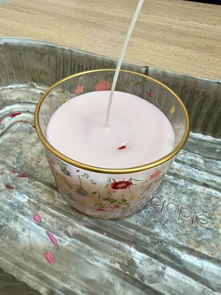 image shows handmade candle with sink hole near wick.