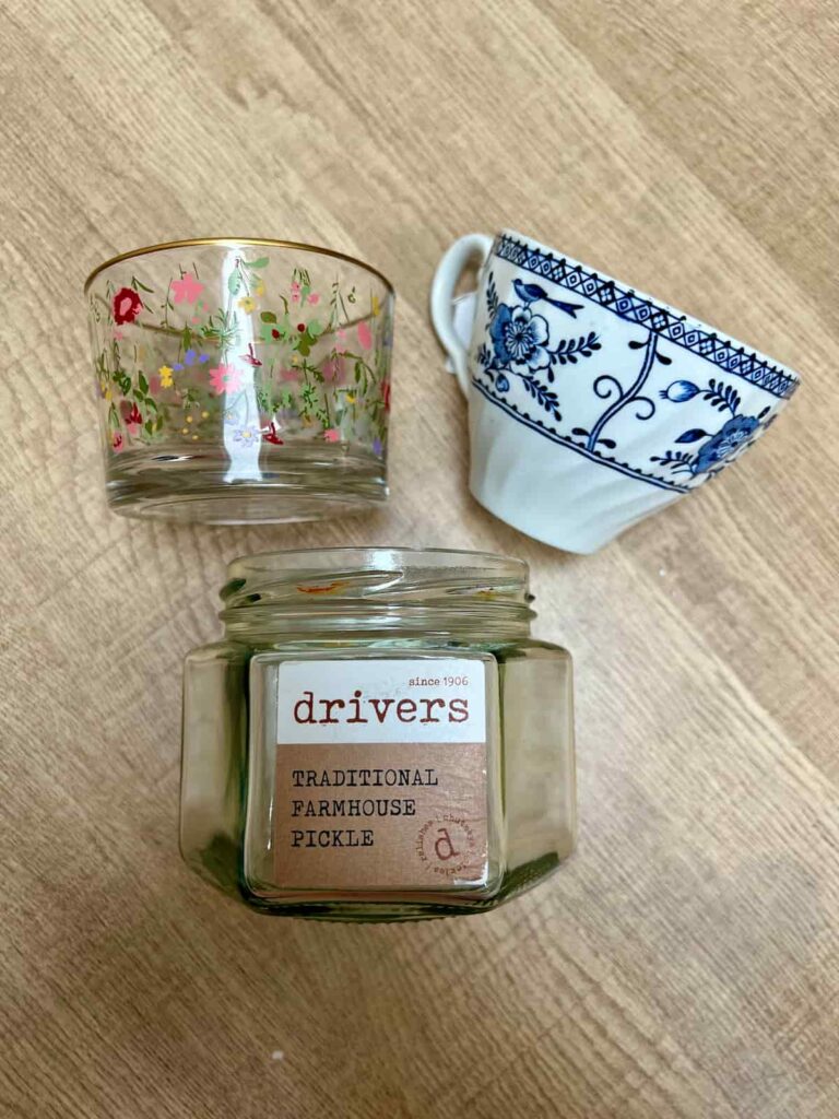 image shows glass containers and a tea cup.