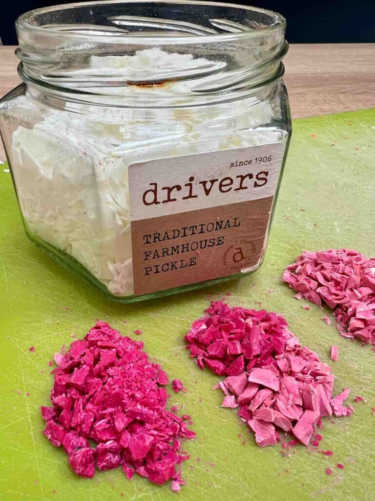 image shows chopped up pink crayons and soy wax flakes.