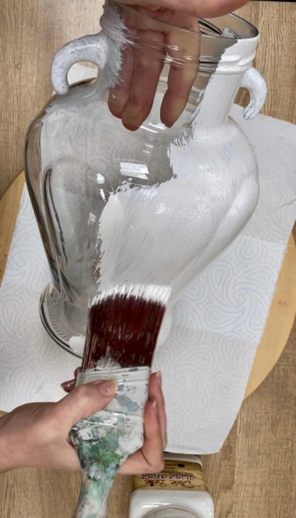 image shows applying slick stick to a glass vase.