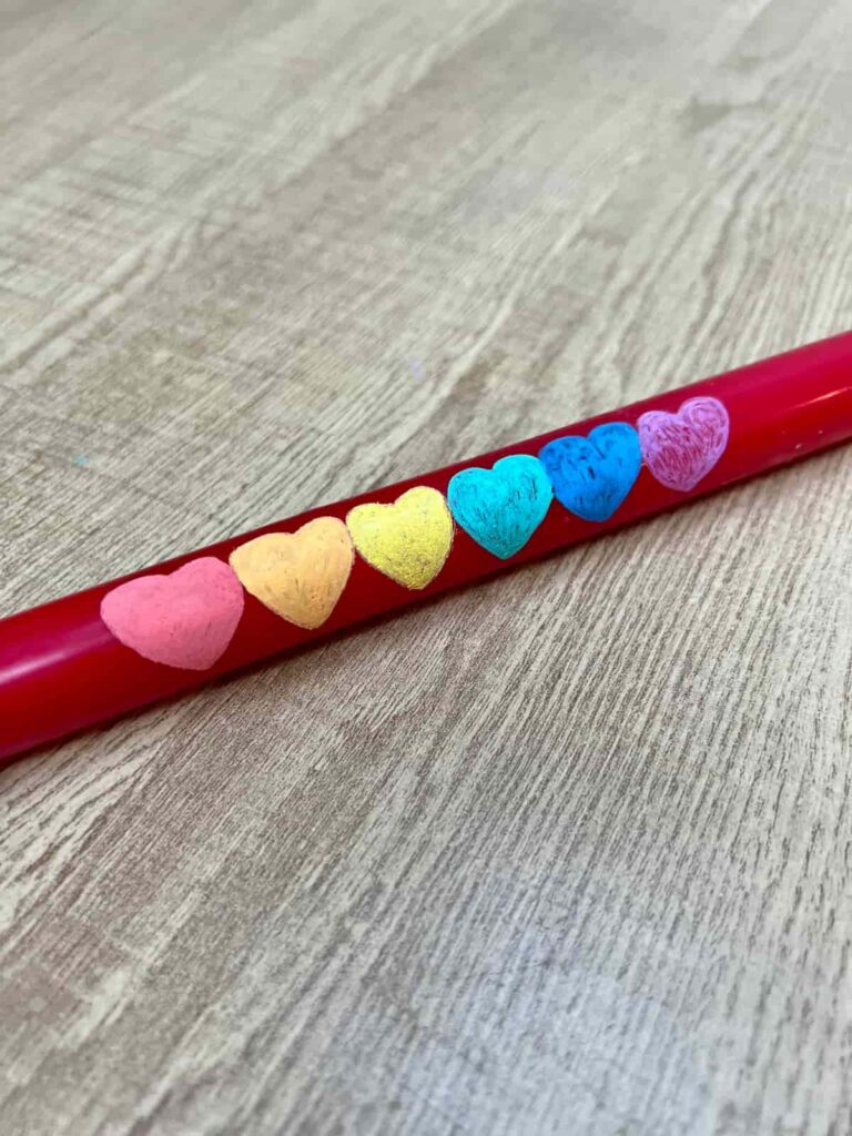 image shows painted hearts on candle with one or two coats of paint.