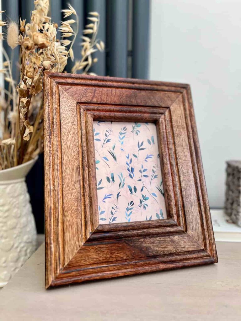 image shows a wooden photo frame after repairing scratches.