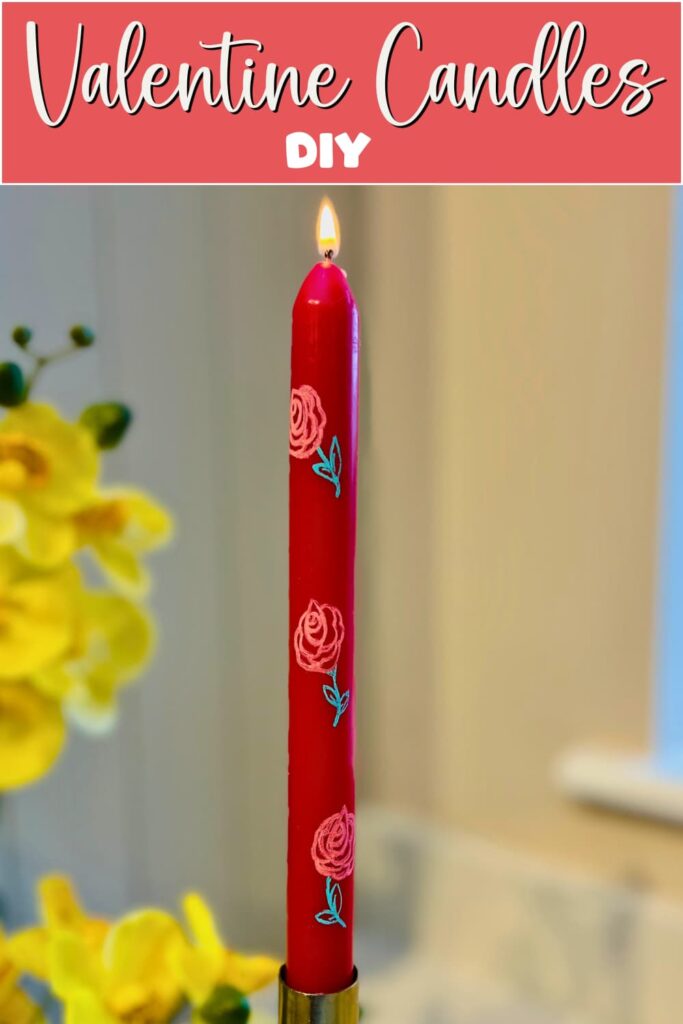 image shows painted candle with rose design.