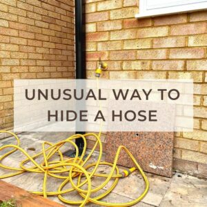 An unusual way to hide a garden hose