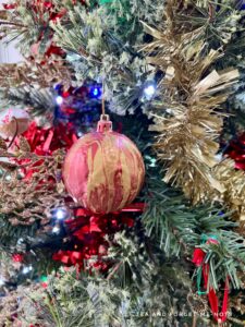 Paint pour red and gold bauble