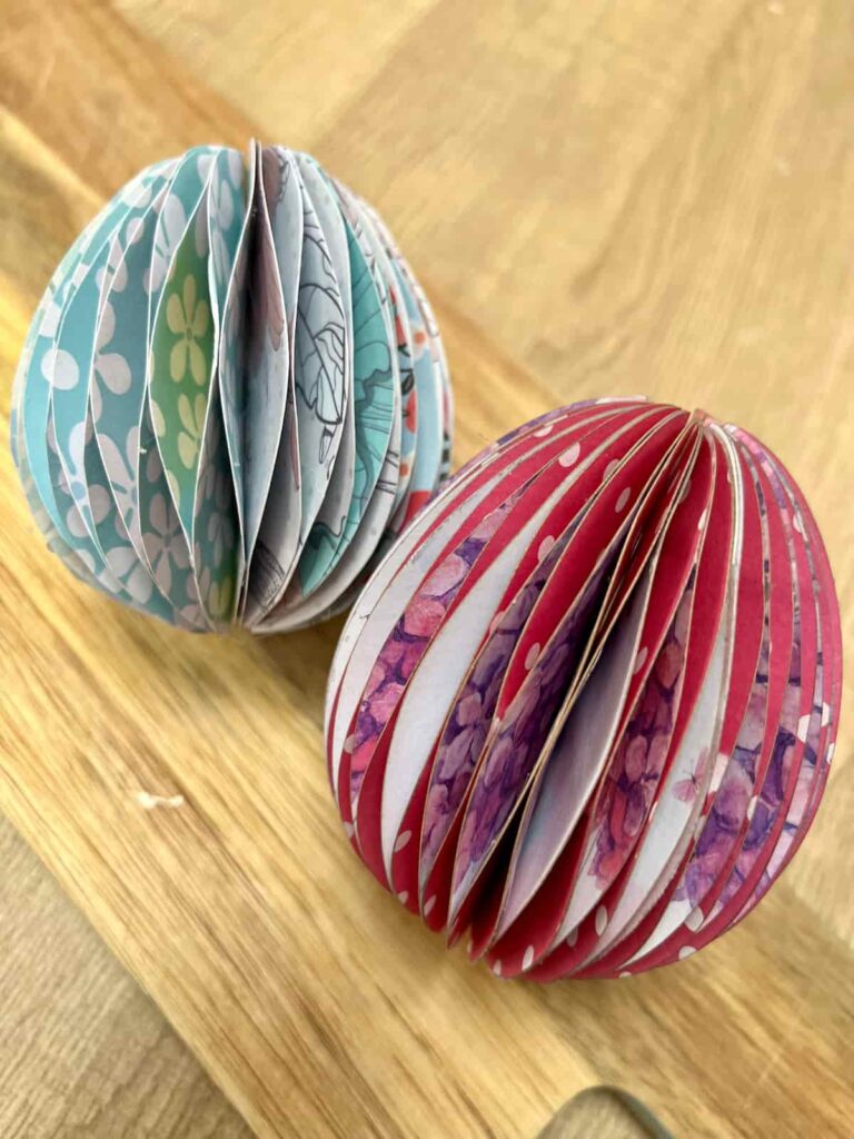 image shows two paper easter eggs made with double-sided card.