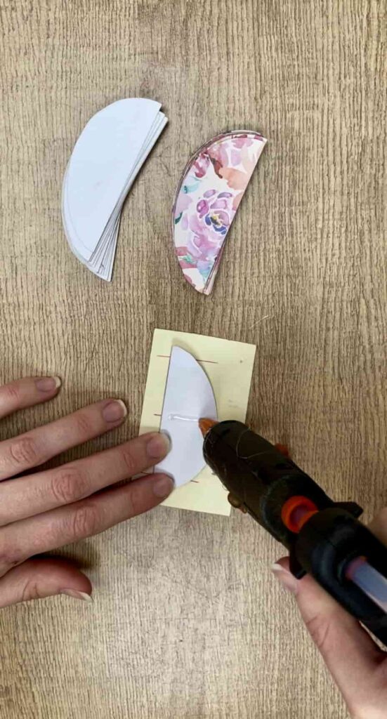 image shows glueing line on paper easter egg.