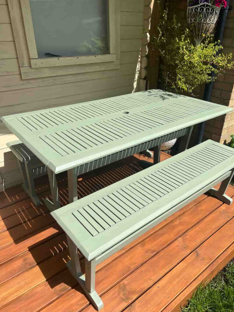 image shows patio table painted green.